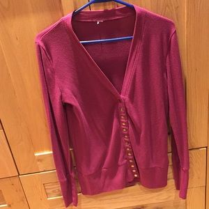 Large raspberry coloured cardigan.